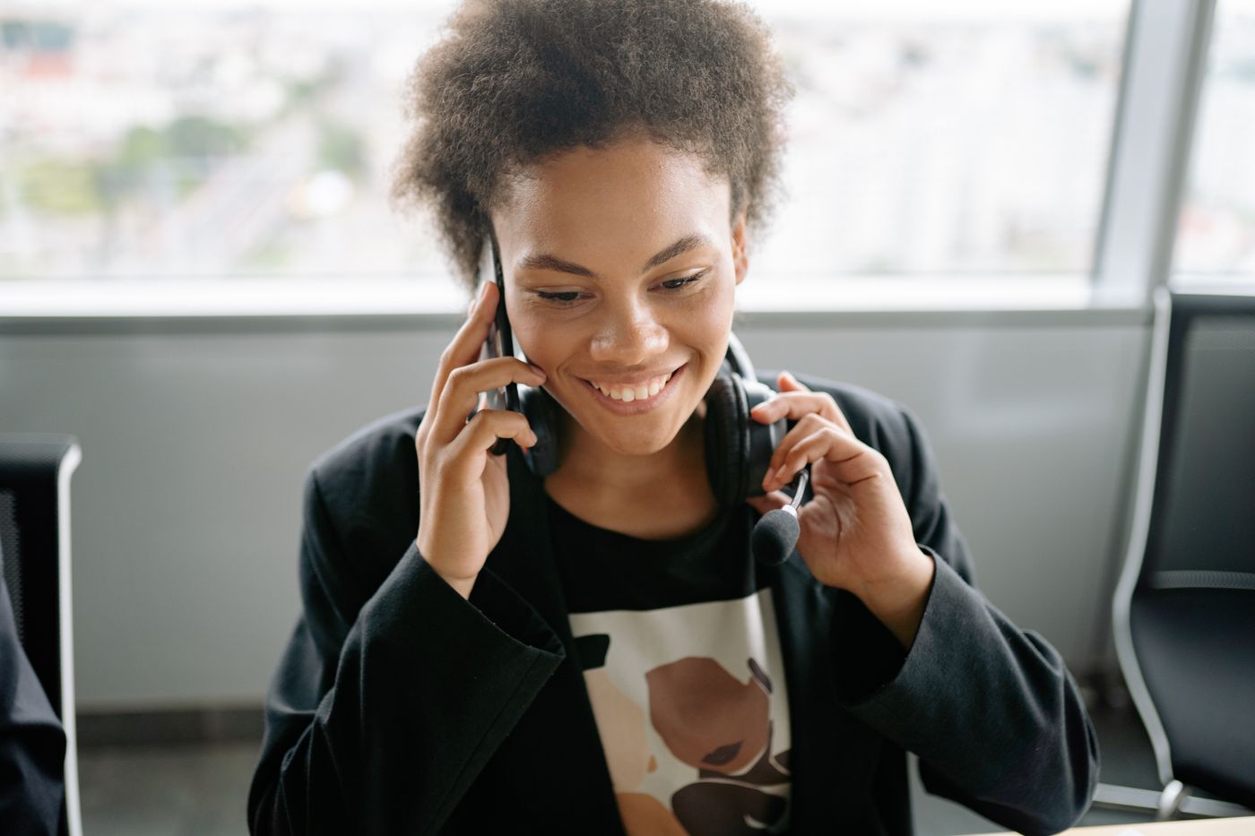 A warm, approachable AltaGrade support specialist on a call